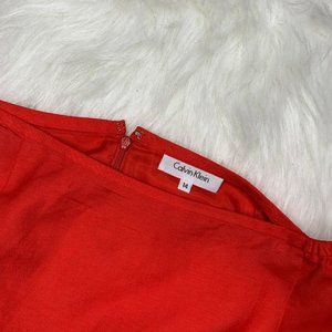 Calvin Klein Red Skirt Size 14 Zips up in back.